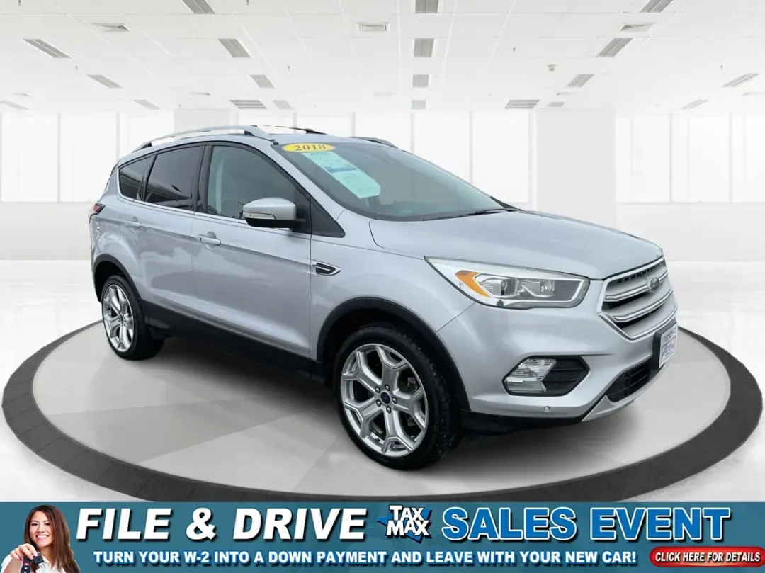 2018 Ford Escape Titanium (1FMCU9J97JU) with an EcoBoost 2L I-4 gasoline direct injection engine, located at 1099 N County Rd 25A, Troy, OH, 45373, (937) 908-9800, 40.057079, -84.212883 - Need an SUV that can handle Ohio weather, daily commutes, and weekend getaways without feeling like a compromise? This 2018 Ford Escape Titanium 4WD in Ingot Silver Metallic is built for real life in Troy-whether you're shuttling kids across town, driving a long commute down I-75, or loading up for - Photo#0