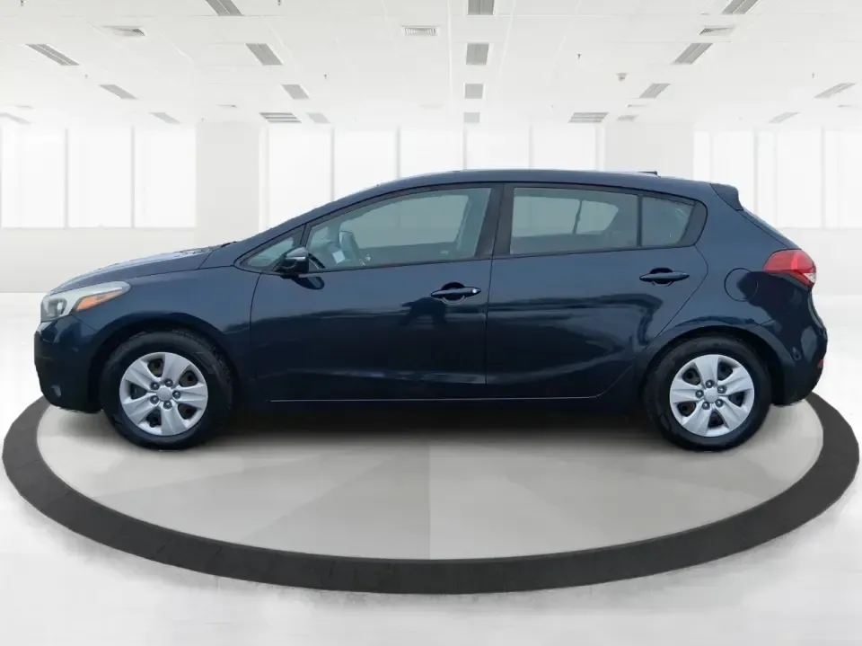 2018 Kia Forte LX (KNAFK5A89J5) with an 2L I-4 DOHC engine, 6A transmission, located at 8750 N County Rd 25A, Piqua, OH, 45356, (937) 908-9800, 40.164391, -84.232513 - Need a smart, budget-friendly ride that can handle daily commutes to Dayton, quick grocery runs, and spontaneous weekend trips without feeling cramped? This 2018 Kia Forte LX Hatchback in Gravity Blue is built for real-life driving in and around New Carlisle-easy to park, efficient to live with, and - Photo#5