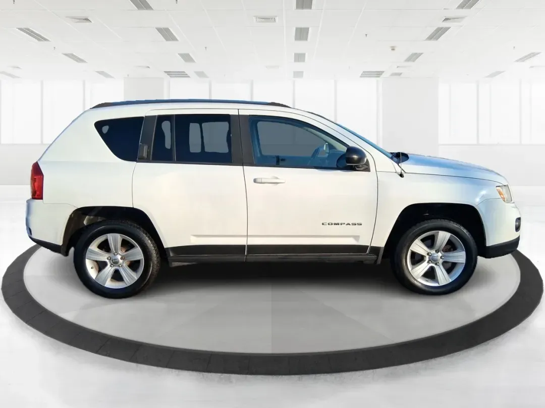 2012 Jeep Compass Latitude (1C4NJDEB4CD) with an 2.4L I-4 DOHC engine, Continuously Variable Transmission transmission, located at 8750 N County Rd 25A, Piqua, OH, 45356, (937) 908-9800, 40.164391, -84.232513 - Need a do-it-all SUV that fits real life in West Central Ohio-school drop-offs, long commutes up I75, and spontaneous weekend escapes to the trails around Johnston Farm and Indian Agency? This 2012 Jeep Compass Latitude 4WD in Bright White Clearcoat is built for that everyday adventure lifestyle, - Photo#1
