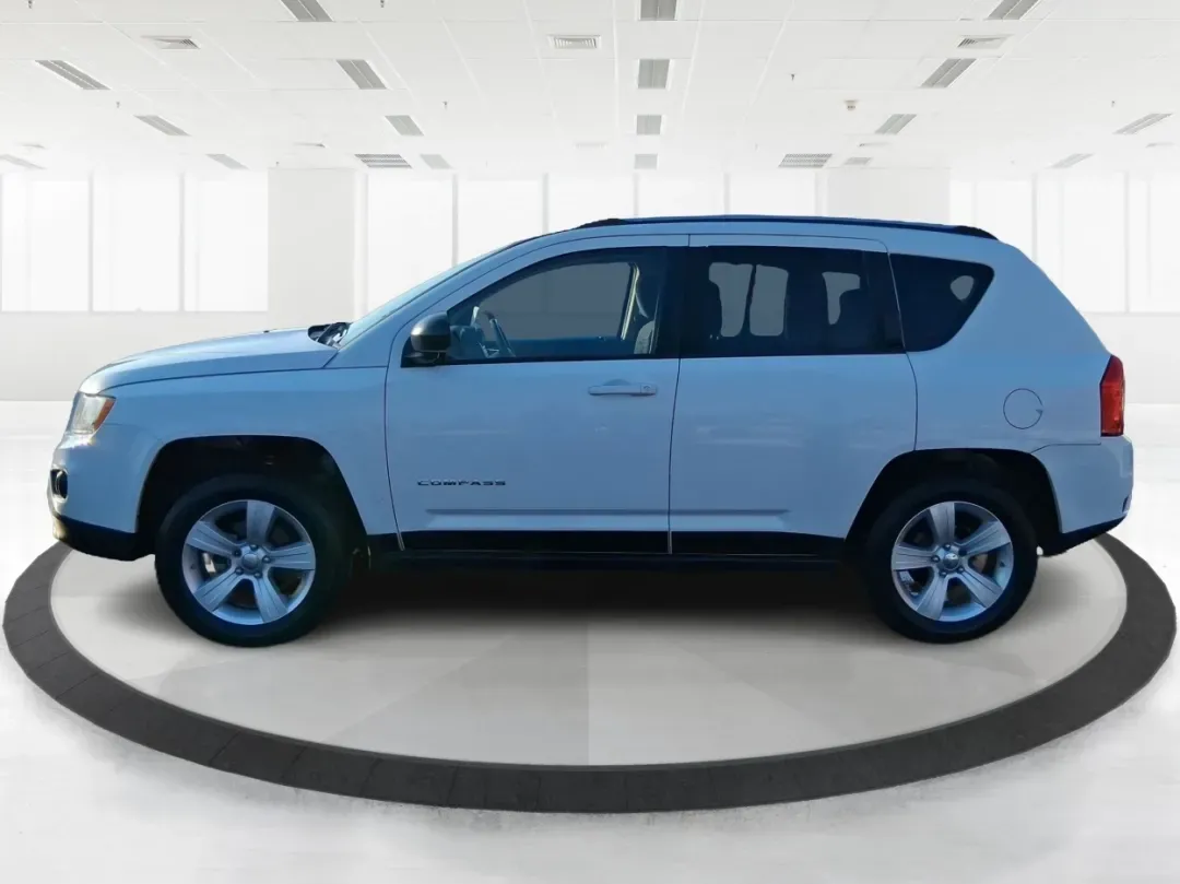 2012 Jeep Compass Latitude (1C4NJDEB4CD) with an 2.4L I-4 DOHC engine, Continuously Variable Transmission transmission, located at 8750 N County Rd 25A, Piqua, OH, 45356, (937) 908-9800, 40.164391, -84.232513 - Need a do-it-all SUV that fits real life in West Central Ohio-school drop-offs, long commutes up I75, and spontaneous weekend escapes to the trails around Johnston Farm and Indian Agency? This 2012 Jeep Compass Latitude 4WD in Bright White Clearcoat is built for that everyday adventure lifestyle, - Photo#5
