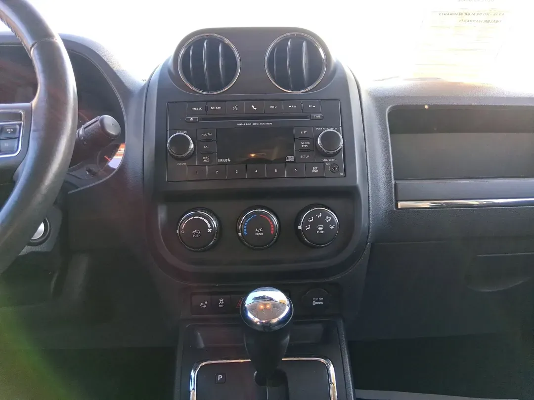 2012 Jeep Compass Latitude (1C4NJDEB4CD) with an 2.4L I-4 DOHC engine, Continuously Variable Transmission transmission, located at 8750 N County Rd 25A, Piqua, OH, 45356, (937) 908-9800, 40.164391, -84.232513 - Need a do-it-all SUV that fits real life in West Central Ohio-school drop-offs, long commutes up I75, and spontaneous weekend escapes to the trails around Johnston Farm and Indian Agency? This 2012 Jeep Compass Latitude 4WD in Bright White Clearcoat is built for that everyday adventure lifestyle, - Photo#12