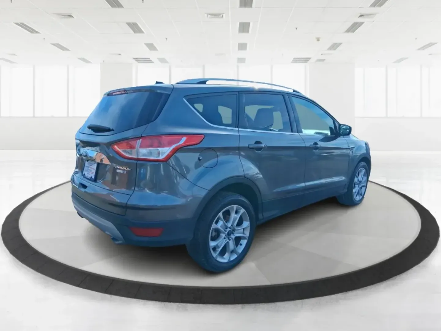 2016 Ford Escape Titanium (1FMCU9J94GU) with an 2.0L L4 DOHC 16V engine, 6-Speed Automatic transmission, located at 1951 S Dayton Lakeview Rd., New Carlisle, OH, 45344, (937) 908-9800, 39.890999, -84.050255 - Picture your next Ohio weekend: a quick grocery run through New Carlisle, a comfortable commute toward Dayton, and then a spontaneous road trip out I70 with the family-without worrying about weather, cargo space, or comfort. This 2016 Ford Escape Titanium in sleek Magnetic is the kind of compact SUV - Photo#2