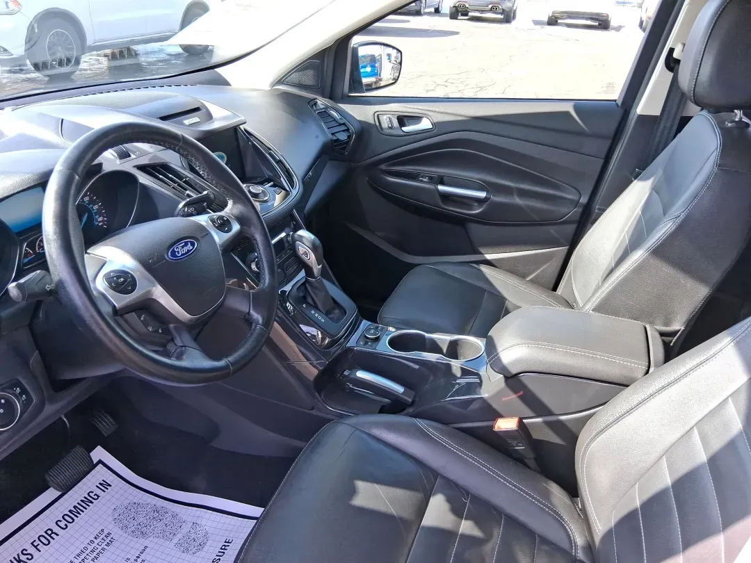 2016 Ford Escape Titanium (1FMCU9J94GU) with an 2.0L L4 DOHC 16V engine, 6-Speed Automatic transmission, located at 1951 S Dayton Lakeview Rd., New Carlisle, OH, 45344, (937) 908-9800, 39.890999, -84.050255 - Picture your next Ohio weekend: a quick grocery run through New Carlisle, a comfortable commute toward Dayton, and then a spontaneous road trip out I70 with the family-without worrying about weather, cargo space, or comfort. This 2016 Ford Escape Titanium in sleek Magnetic is the kind of compact SUV - Photo#9