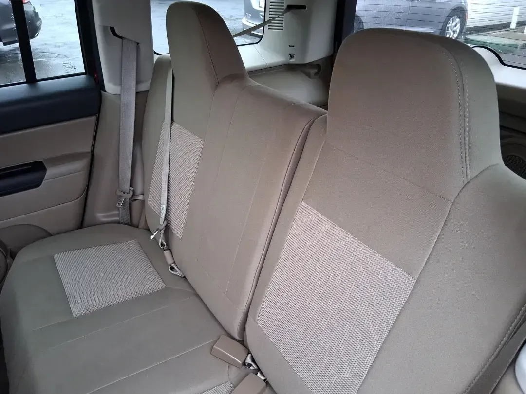 2012 Jeep Patriot Latitude (1C4NJPFB0CD) with an 2.4L L4 DOHC 16V engine, located at 1099 N County Rd 25A, Troy, OH, 45373, (937) 908-9800, 40.057079, -84.212883 - Picture your next weekend: a quick run up I-75 for a family visit, a scenic drive past the Miami River, then an easy loop back through downtown Troy for dinner-without worrying about whether your SUV can keep up with daily life. This 2012 Jeep Patriot Latitude is built for practical adventures and e - Photo#10