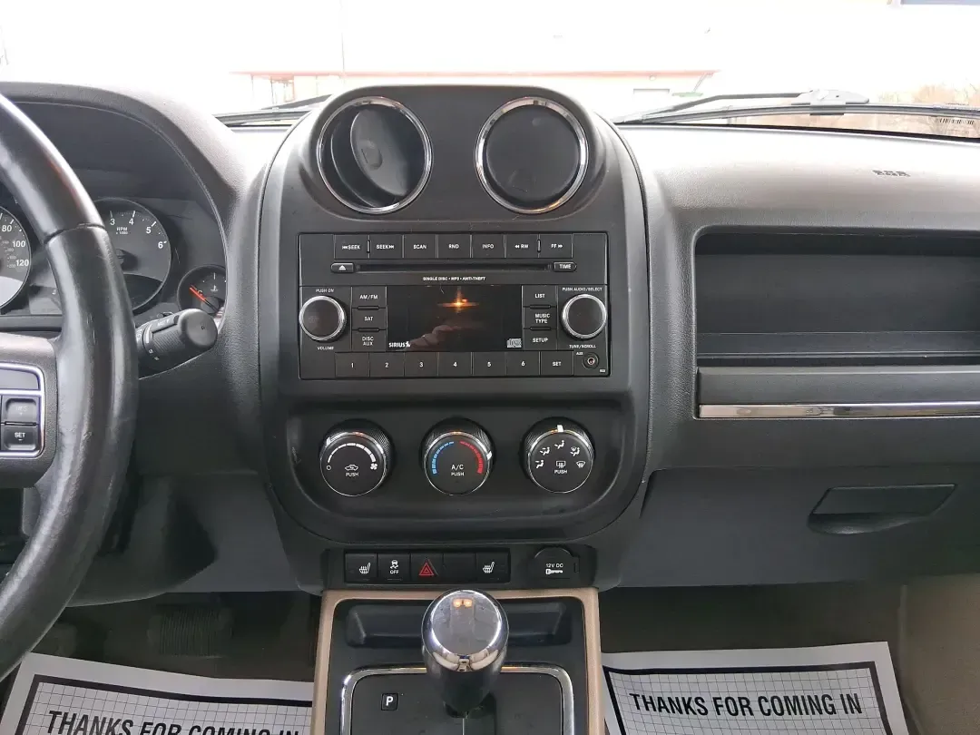 2012 Jeep Patriot Latitude (1C4NJPFB0CD) with an 2.4L L4 DOHC 16V engine, located at 1099 N County Rd 25A, Troy, OH, 45373, (937) 908-9800, 40.057079, -84.212883 - Picture your next weekend: a quick run up I-75 for a family visit, a scenic drive past the Miami River, then an easy loop back through downtown Troy for dinner-without worrying about whether your SUV can keep up with daily life. This 2012 Jeep Patriot Latitude is built for practical adventures and e - Photo#13