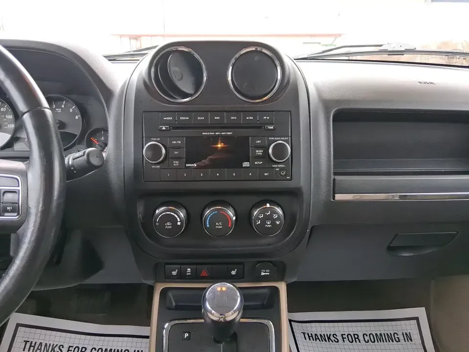 2012 Jeep Patriot Latitude (1C4NJPFB0CD) with an 2.4L L4 DOHC 16V engine, located at 1230 East Main St, Xenia, OH, 45385, (937) 908-9800, 39.688026, -83.910172 - Picture your next weekend: a quick run up I-75 for a family visit, a scenic drive past the Miami River, then an easy loop back through downtown Troy for dinner-without worrying about whether your SUV can keep up with daily life. This 2012 Jeep Patriot Latitude is built for practical adventures and e - Photo#13