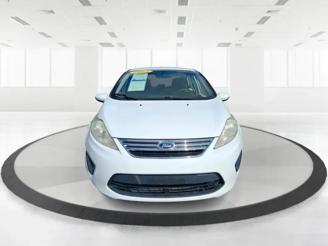 2013 Ford Fiesta SE (3FADP4BJXDM) with an 1.6L I-4 DOHC engine, located at 1951 S Dayton Lakeview Rd., New Carlisle, OH, 45344, (937) 908-9800, 39.890999, -84.050255 - Need a smart, efficient commuter that's easy to park downtown, nimble on I70, and still comfortable for weekend errands or a quick getaway to Springfield or Dayton? This 2013 Ford Fiesta SE Sedan in Oxford White delivers practical daily driving with the kind of budget-friendly ownership that fits re - Photo#7