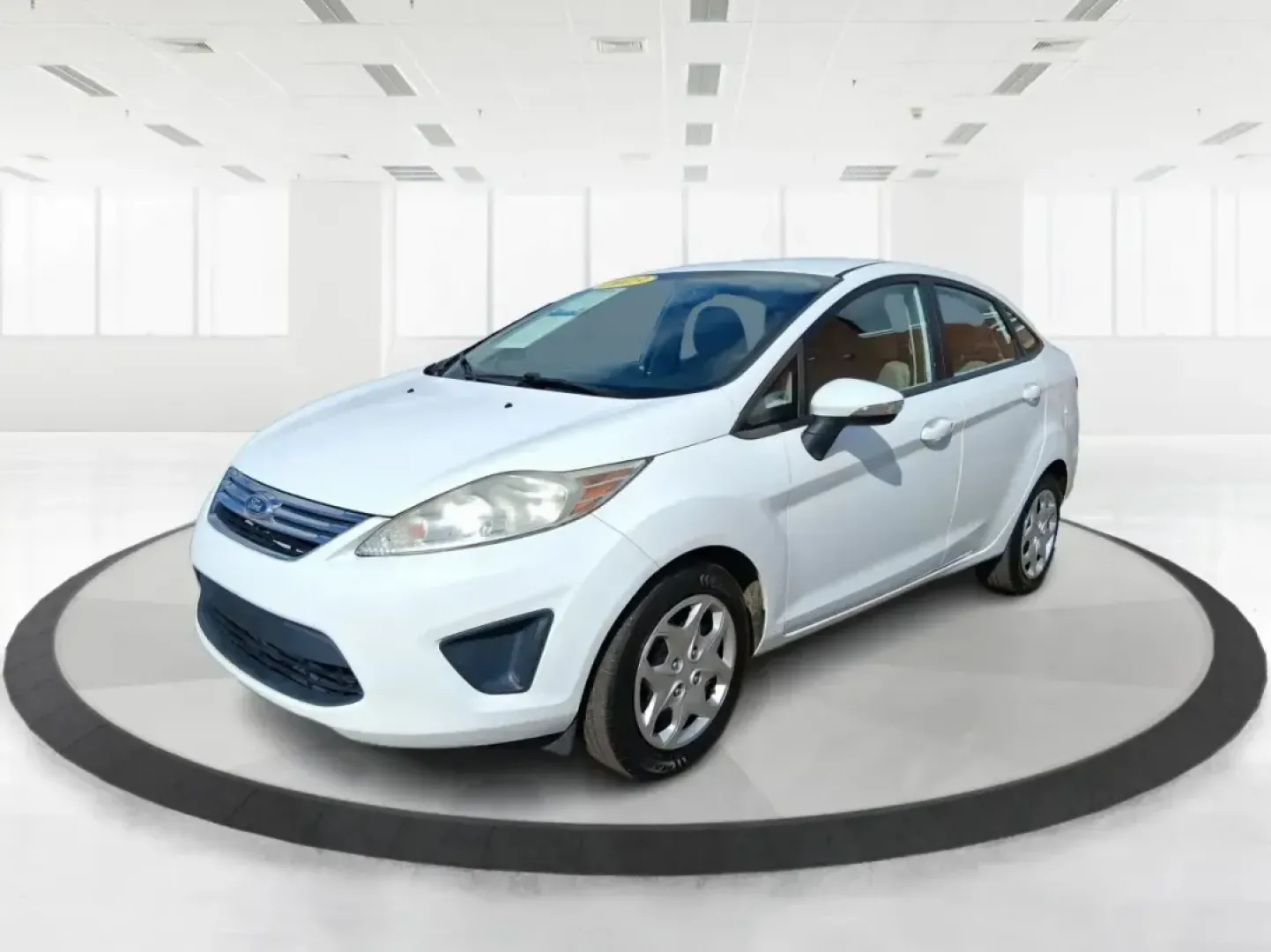 2013 Ford Fiesta SE (3FADP4BJXDM) with an 1.6L I-4 DOHC engine, located at 1951 S Dayton Lakeview Rd., New Carlisle, OH, 45344, (937) 908-9800, 39.890999, -84.050255 - Need a smart, efficient commuter that's easy to park downtown, nimble on I70, and still comfortable for weekend errands or a quick getaway to Springfield or Dayton? This 2013 Ford Fiesta SE Sedan in Oxford White delivers practical daily driving with the kind of budget-friendly ownership that fits re - Photo#8