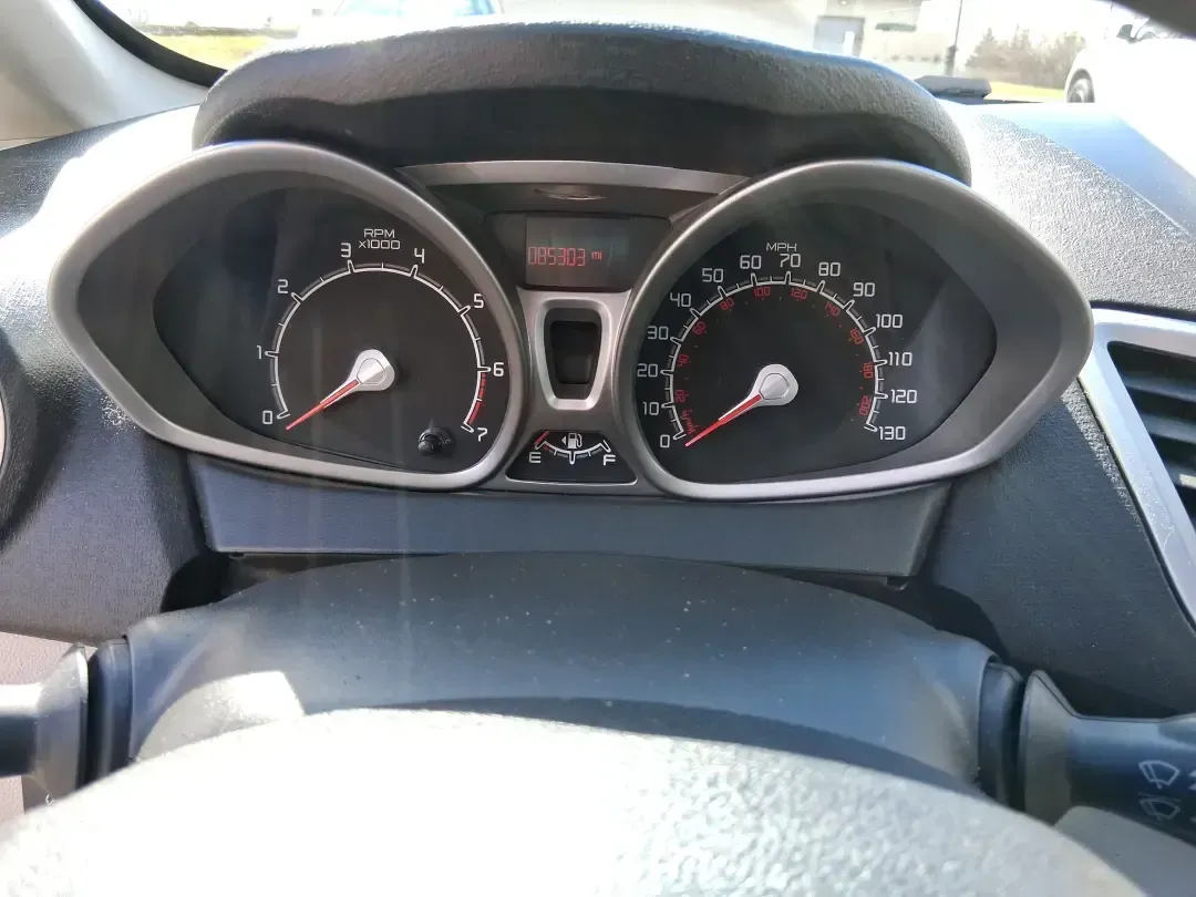 2013 Ford Fiesta SE (3FADP4BJXDM) with an 1.6L I-4 DOHC engine, located at 1951 S Dayton Lakeview Rd., New Carlisle, OH, 45344, (937) 908-9800, 39.890999, -84.050255 - Need a smart, efficient commuter that's easy to park downtown, nimble on I70, and still comfortable for weekend errands or a quick getaway to Springfield or Dayton? This 2013 Ford Fiesta SE Sedan in Oxford White delivers practical daily driving with the kind of budget-friendly ownership that fits re - Photo#15