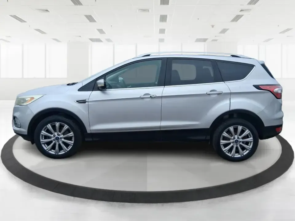 2017 Ford Escape Titanium (1FMCU9J9XHU) with an 2.0L L4 DOHC 16V engine, 6A transmission, located at 4508 South Dixie Dr, Moraine, OH, 45439, (937) 908-9800, 39.689976, -84.218452 - Picture your next Ohio weekend: a comfortable SUV loaded with gear, cruising down I-75 for a quick Dayton outing, then turning toward the MetroParks for a hike-without worrying about winter weather, tight parking lots, or long-drive fatigue. This 2017 Ford Escape Titanium is built for real life in M - Photo#5