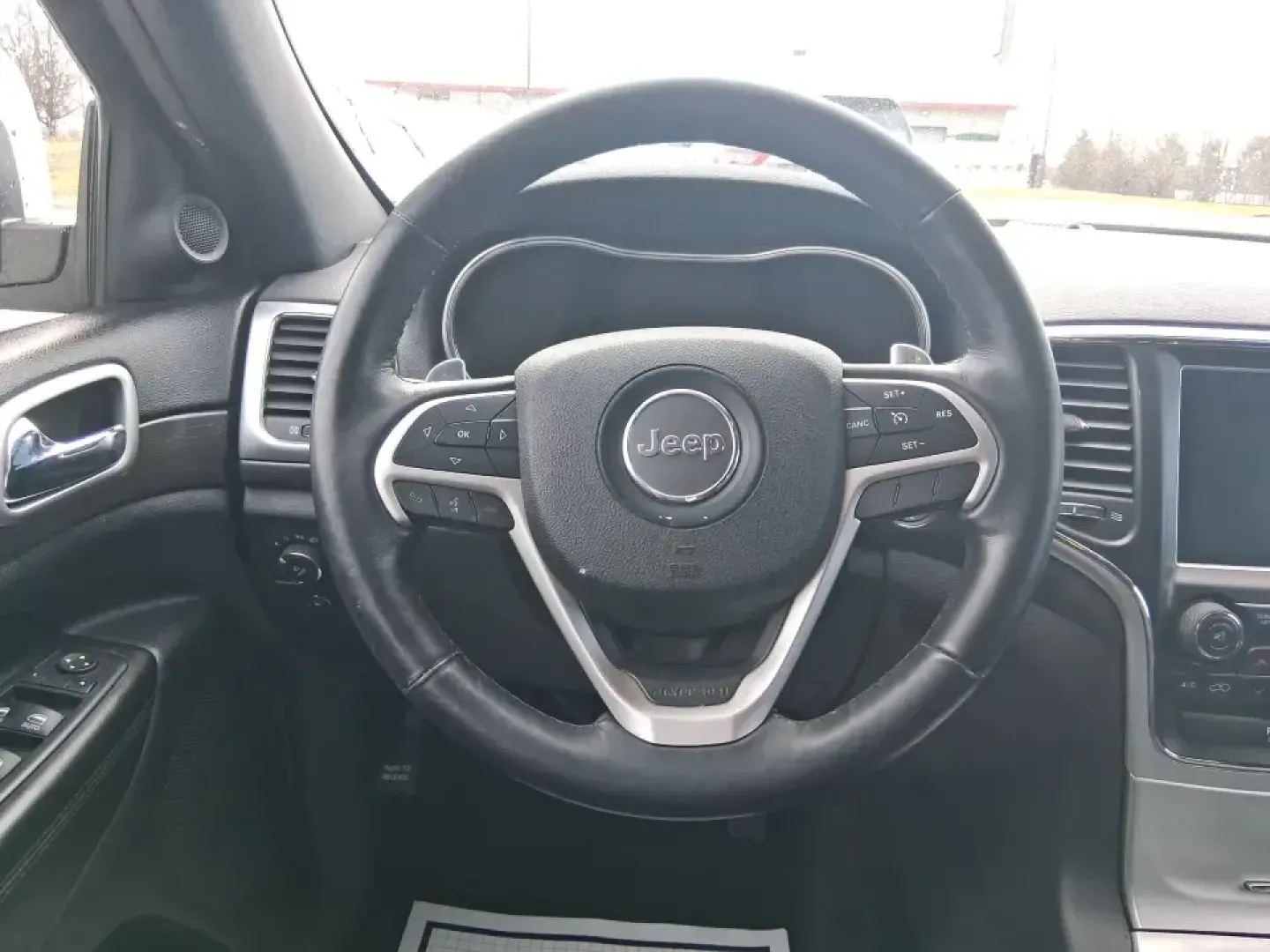 2015 Jeep Grand Cherokee Altitude (1C4RJFAG9FC) with an 3.6L V-6 DOHC engine, 8-Speed Automatic transmission, located at 1099 N County Rd 25A, Troy, OH, 45373, (937) 908-9800, 40.057079, -84.212883 - Weekend getaways to Hocking Hills, snowy school runs, or a confident daily commute up I75 feel easier when your SUV is built for real Ohio weather and real-life schedules. This 2015 Jeep Grand Cherokee Altitude in Bright White Clearcoat is the kind of capable, comfortable SUV that fits busy families - Photo#16