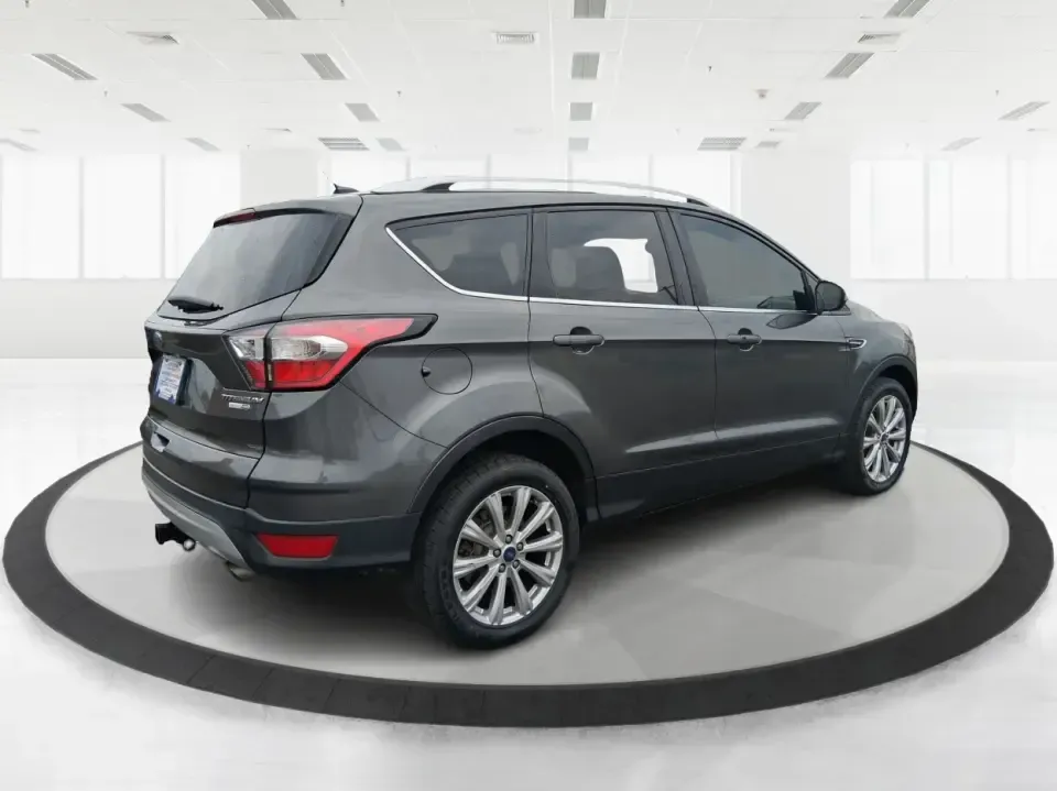 2017 Ford Escape Titanium (1FMCU9J94HU) with an 2.0L L4 DOHC 16V engine, 6A transmission, located at 8750 N County Rd 25A, Piqua, OH, 45356, (937) 908-9800, 40.164391, -84.232513 - Pack the gear, load up the family, and point the GPS toward your next weekend escape-this 2017 Ford Escape Titanium is the kind of compact SUV that fits real life in Piqua. Whether you're commuting up I75, running errands along N County Rd 25A, or planning a day trip to Lock 9 Park and the Great Mia - Photo#2