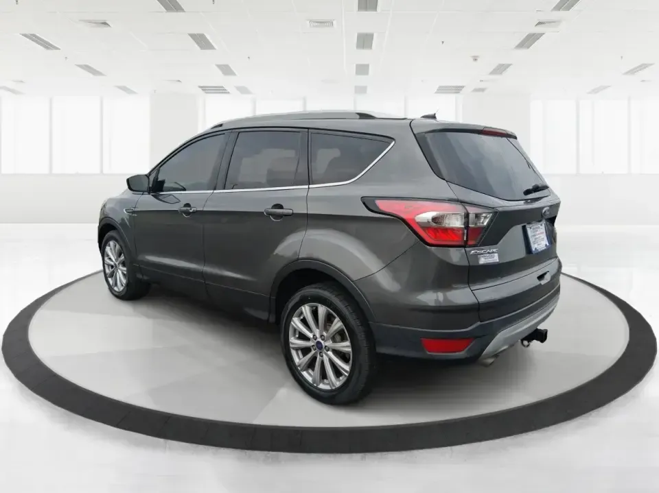 2017 Ford Escape Titanium (1FMCU9J94HU) with an 2.0L L4 DOHC 16V engine, 6A transmission, located at 8750 N County Rd 25A, Piqua, OH, 45356, (937) 908-9800, 40.164391, -84.232513 - Pack the gear, load up the family, and point the GPS toward your next weekend escape-this 2017 Ford Escape Titanium is the kind of compact SUV that fits real life in Piqua. Whether you're commuting up I75, running errands along N County Rd 25A, or planning a day trip to Lock 9 Park and the Great Mia - Photo#4