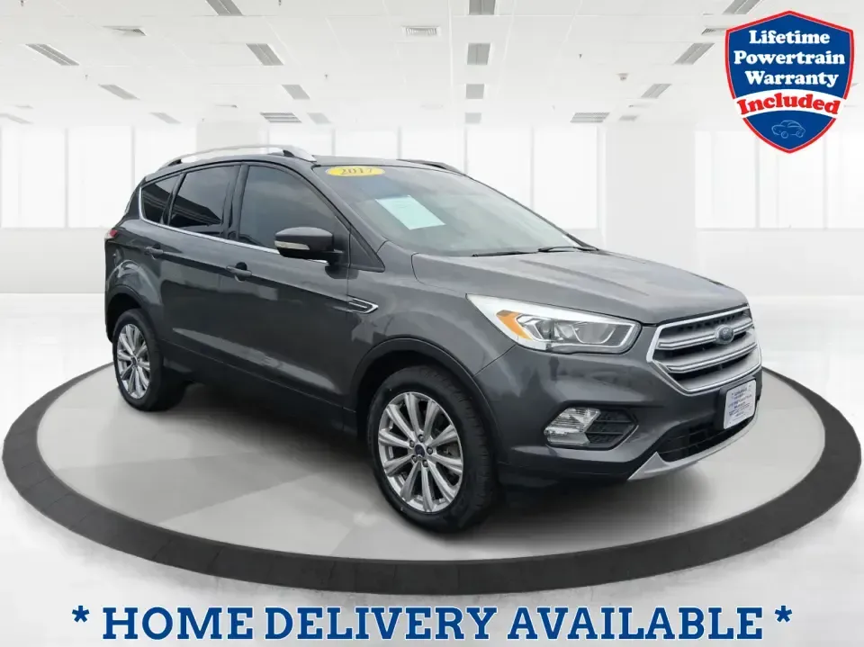 2017 Ford Escape Titanium (1FMCU9J94HU) with an 2.0L L4 DOHC 16V engine, 6A transmission, located at 1951 S Dayton Lakeview Rd., New Carlisle, OH, 45344, (937) 908-9800, 39.890999, -84.050255 - Pack the gear, load up the family, and point the GPS toward your next weekend escape-this 2017 Ford Escape Titanium is the kind of compact SUV that fits real life in Piqua. Whether you're commuting up I75, running errands along N County Rd 25A, or planning a day trip to Lock 9 Park and the Great Mia - Photo#0