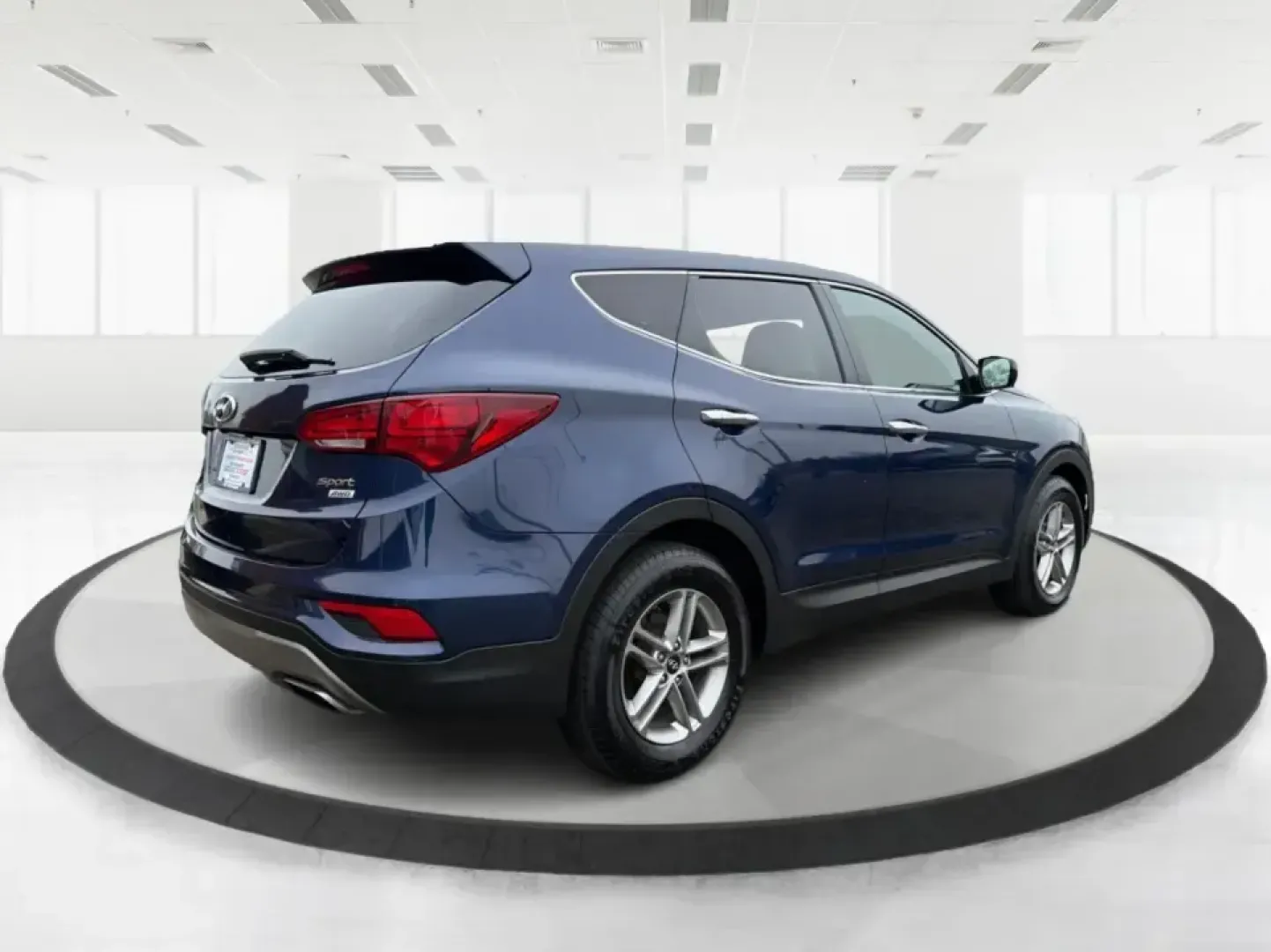 2018 Hyundai Santa Fe 2.4L (5XYZTDLB6JG) with an Theta II 2.4L I-4 gasoline direct injection engine, 6A transmission, located at 8750 N County Rd 25A, Piqua, OH, 45356, (937) 908-9800, 40.164391, -84.232513 - Road trips to Indian Lake, snowy school runs, and everyday commuting up and down I75 feel a lot easier when your SUV is roomy, confident in bad weather, and comfortable for everyone on board. This 2018 Hyundai Santa Fe 2.4L in striking Nightfall Blue is a practical, family-friendly sport utility tha - Photo#2