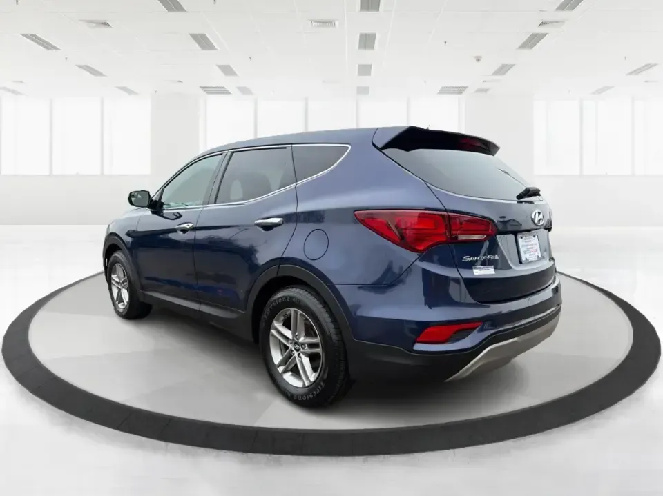 2018 Hyundai Santa Fe 2.4L (5XYZTDLB6JG) with an Theta II 2.4L I-4 gasoline direct injection engine, 6A transmission, located at 8750 N County Rd 25A, Piqua, OH, 45356, (937) 908-9800, 40.164391, -84.232513 - Road trips to Indian Lake, snowy school runs, and everyday commuting up and down I75 feel a lot easier when your SUV is roomy, confident in bad weather, and comfortable for everyone on board. This 2018 Hyundai Santa Fe 2.4L in striking Nightfall Blue is a practical, family-friendly sport utility tha - Photo#4