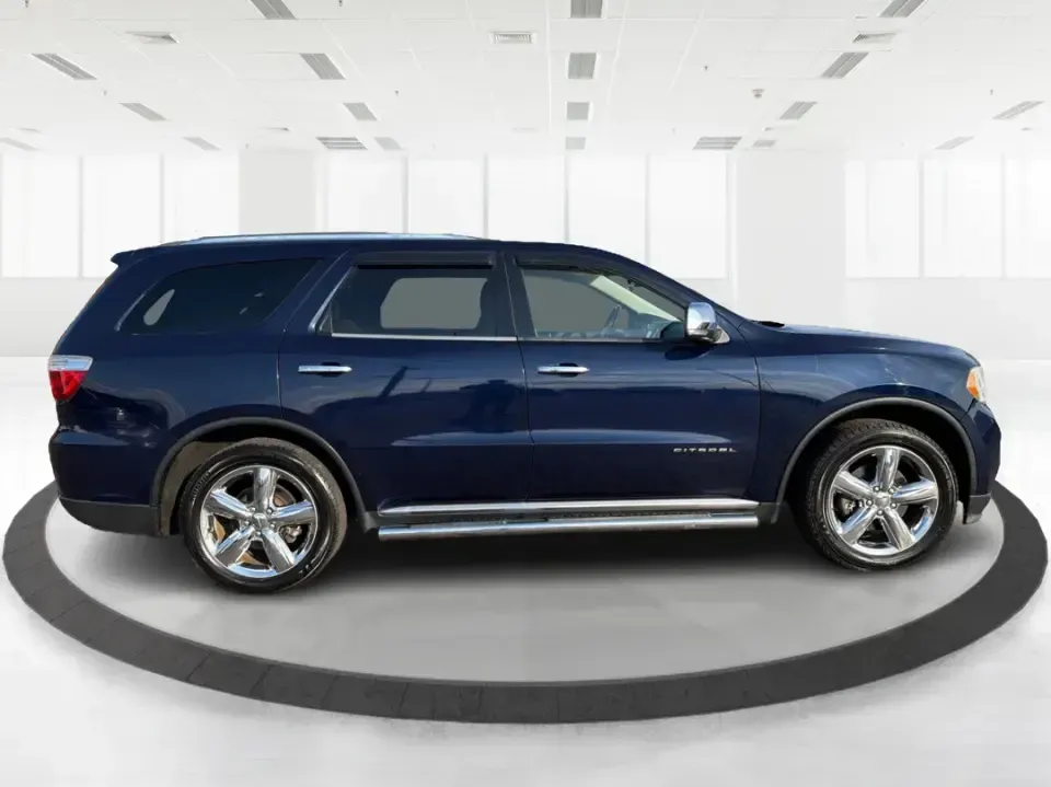 2013 Dodge Durango Citadel (1C4SDJET6DC) with an 5.7L V8 OHV 16V engine, 5-Speed Automatic transmission, located at 1951 S Dayton Lakeview Rd., New Carlisle, OH, 45344, (937) 908-9800, 39.890999, -84.050255 - Need one SUV that can handle school drop-offs, I-75 commutes, and a loaded-up weekend trip to Indian Lake or a tailgate in Dayton-without giving up comfort or capability? This 2013 Dodge Durango Citadel in True Blue Pearlcoat is built for real-life Ohio driving, with confident 4WD/AWD traction, V8 p - Photo#1