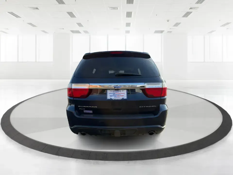 2013 Dodge Durango Citadel (1C4SDJET6DC) with an 5.7L V8 OHV 16V engine, 5-Speed Automatic transmission, located at 1951 S Dayton Lakeview Rd., New Carlisle, OH, 45344, (937) 908-9800, 39.890999, -84.050255 - Need one SUV that can handle school drop-offs, I-75 commutes, and a loaded-up weekend trip to Indian Lake or a tailgate in Dayton-without giving up comfort or capability? This 2013 Dodge Durango Citadel in True Blue Pearlcoat is built for real-life Ohio driving, with confident 4WD/AWD traction, V8 p - Photo#3