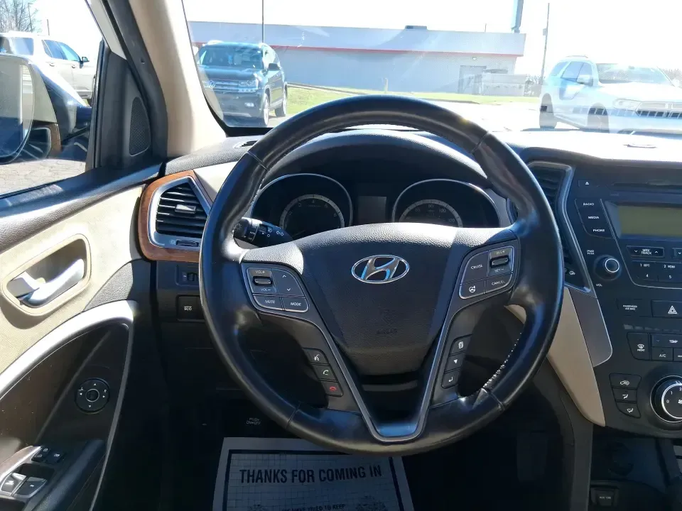 2013 Hyundai Santa Fe Sport (5XYZU3LB7DG) with an Theta II 2.4L I-4 gasoline direct injection engine, 6-Speed Automatic transmission, located at 880 E. National Road, Vandalia, OH, 45377, (937) 908-9800, 39.891918, -84.183594 - Need one SUV that can handle school drop-offs, I75 commutes, and a weekend escape to Taylorsville MetroPark without draining your budget? This 2013 Hyundai Santa Fe Sport is a smart, road-trip-ready crossover that blends everyday practicality with comfort features you'll appreciate on longer drives - Photo#16