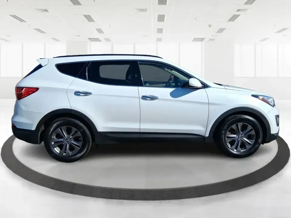 2013 Hyundai Santa Fe Sport (5XYZU3LB7DG) with an Theta II 2.4L I-4 gasoline direct injection engine, 6-Speed Automatic transmission, located at 1951 S Dayton Lakeview Rd., New Carlisle, OH, 45344, (937) 908-9800, 39.890999, -84.050255 - Need one SUV that can handle school drop-offs, I75 commutes, and a weekend escape to Taylorsville MetroPark without draining your budget? This 2013 Hyundai Santa Fe Sport is a smart, road-trip-ready crossover that blends everyday practicality with comfort features you'll appreciate on longer drives - Photo#1