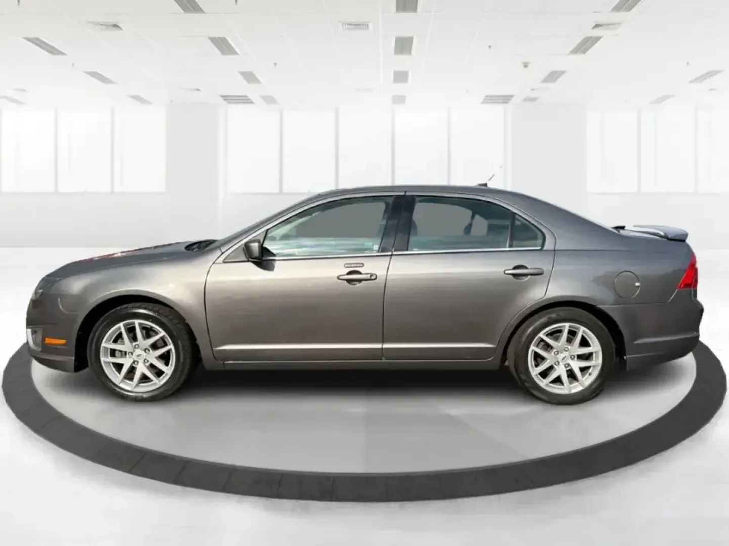 2012 Ford Fusion SEL (3FAHP0JG7CR) with an 3.0L V6 DOHC 24V engine, located at 1099 N County Rd 25A, Troy, OH, 45373, (937) 908-9800, 40.057079, -84.212883 - Need a dependable sedan that can handle the weekday commute to Dayton, quick runs up I75, and comfortable weekend drives through Miami County without draining your budget? This 2012 Ford Fusion SEL is a smart, real-world choice for drivers who want a smooth ride, confident power, and everyday practi - Photo#5