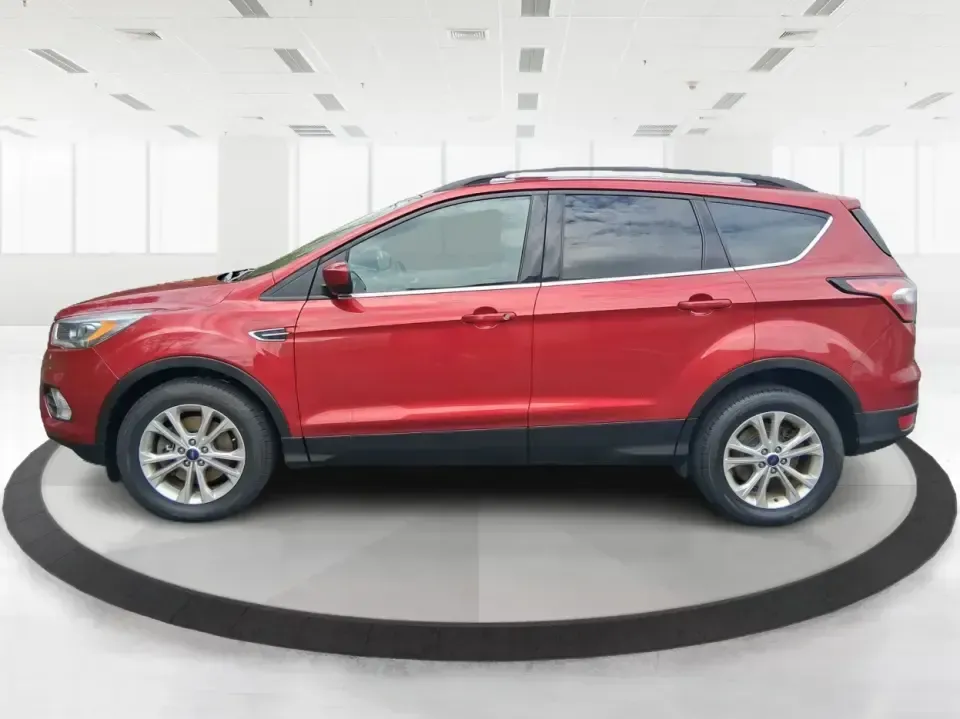 2018 Ford Escape SEL (1FMCU9HD2JU) with an 1.5L L4 DOHC 16V engine, 6A transmission, located at 4508 South Dixie Dr, Moraine, OH, 45439, (937) 908-9800, 39.689976, -84.218452 - Need a do-it-all SUV that can handle the weekday commute on I-675, quick school drop-offs near Wright-Patterson AFB, and spontaneous weekend getaways to Carillon Historical Park or a lap around Eastwood MetroPark? This 2018 Ford Escape SEL in Ruby Red Metallic Tinted Clearcoat is built for real-life - Photo#5