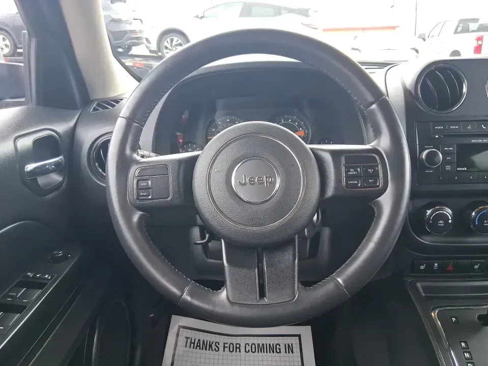 2014 Jeep Patriot Latitude (1C4NJPFB3ED) with an 2.4L L4 DOHC 16V engine, located at 8750 N County Rd 25A, Piqua, OH, 45356, (937) 908-9800, 40.164391, -84.232513 - Pack up the snacks, cue the playlist, and point the hood toward your next weekend escape-this 2014 Jeep Patriot Latitude is the kind of practical SUV that fits real life in West Central Ohio, whether you're commuting daily, shuttling kids to practice, or chasing fall colors on a backroad drive. Fini - Photo#16