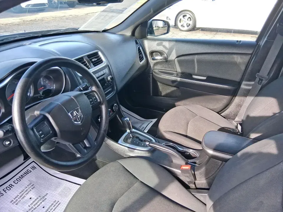 2014 Dodge Avenger SE (1C3CDZAB8EN) with an 2.4L L4 DOHC 16V engine, 4-Speed Automatic transmission, located at 1099 N County Rd 25A, Troy, OH, 45373, (937) 908-9800, 40.057079, -84.212883 - Picture an easy, stress-free daily commute from Moraine to downtown Dayton, with enough comfort for the school run, errands along South Dixie Drive, and the occasional weekend escape to Carillon Historical Park or a movie night near the Dayton Mall. If you want a practical sedan that fits real life- - Photo#9