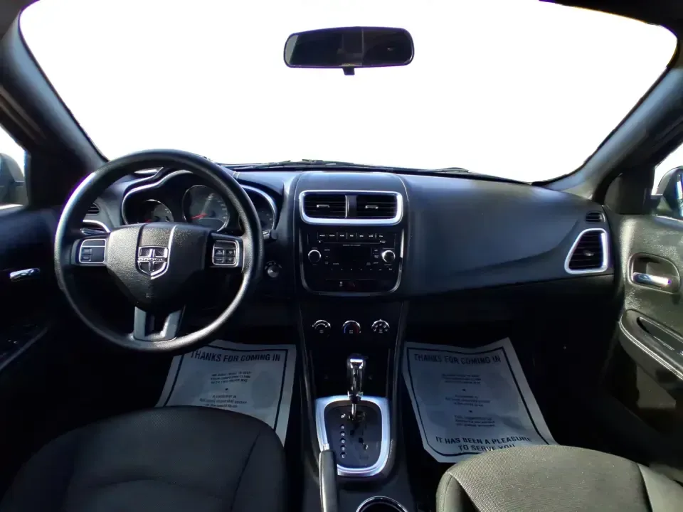 2014 Dodge Avenger SE (1C3CDZAB8EN) with an 2.4L L4 DOHC 16V engine, 4-Speed Automatic transmission, located at 1099 N County Rd 25A, Troy, OH, 45373, (937) 908-9800, 40.057079, -84.212883 - Picture an easy, stress-free daily commute from Moraine to downtown Dayton, with enough comfort for the school run, errands along South Dixie Drive, and the occasional weekend escape to Carillon Historical Park or a movie night near the Dayton Mall. If you want a practical sedan that fits real life- - Photo#19