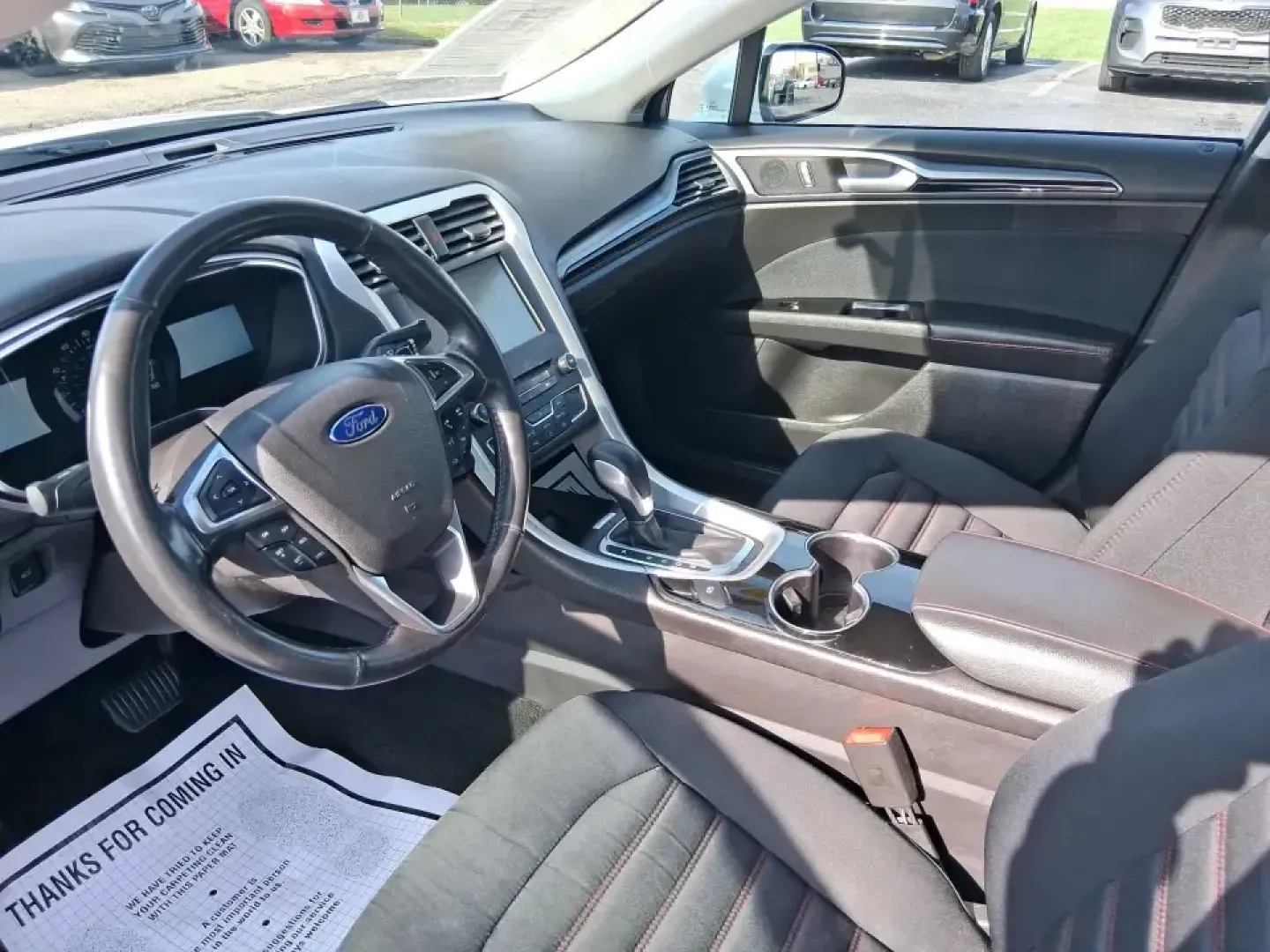 2016 Ford Fusion SE (3FA6P0H91GR) with an 2.0L L4 DOHC 16V engine, 6-Speed Automatic transmission, located at 880 E. National Road, Vandalia, OH, 45377, (937) 908-9800, 39.891918, -84.183594 - Need a dependable commuter that can handle I75 traffic, school drop-offs, and weekend runs to Dayton without draining your budget? This 2016 Ford Fusion SE in Oxford White is the kind of practical, comfortable sedan that fits real life in Vandalia-smooth for daily driving, efficient on regular unlea - Photo#9