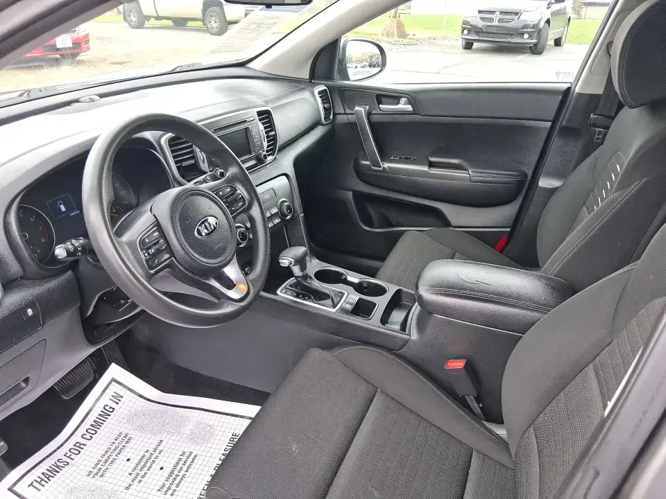 2018 Kia Sportage LX (KNDPM3AC0J7) with an Theta II 2.4L I-4 gasoline direct injection engine, 6A transmission, located at 1099 N County Rd 25A, Troy, OH, 45373, (937) 908-9800, 40.057079, -84.212883 - Weekend road trips to the Miami County Fair, daily commutes down I75, or quick errands between Downtown Troy and the shops near West Main Street-this 2018 Kia Sportage LX is the kind of compact SUV that fits real life. With its versatile crossover layout, confident road manners, and smart cargo spac - Photo#9