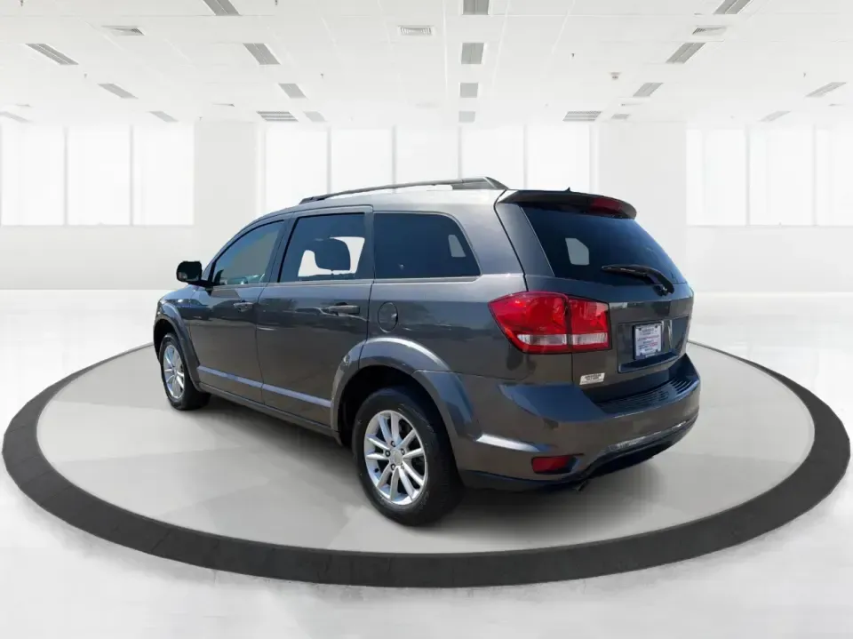 2014 Dodge Journey SXT (3C4PDDBG0ET) with an 3.6L V-6 DOHC engine, 6-Speed Automatic transmission, located at 1099 N County Rd 25A, Troy, OH, 45373, (937) 908-9800, 40.057079, -84.212883 - Pack up the kids, the dog, and the weekend bags-this 2014 Dodge Journey SXT is the kind of SUV that makes everyday life in Troy easier and spontaneous road trips feel completely doable. Whether you're tackling school drop-offs, commuting to Dayton, or planning a family day at the Miami County Fairgr - Photo#4