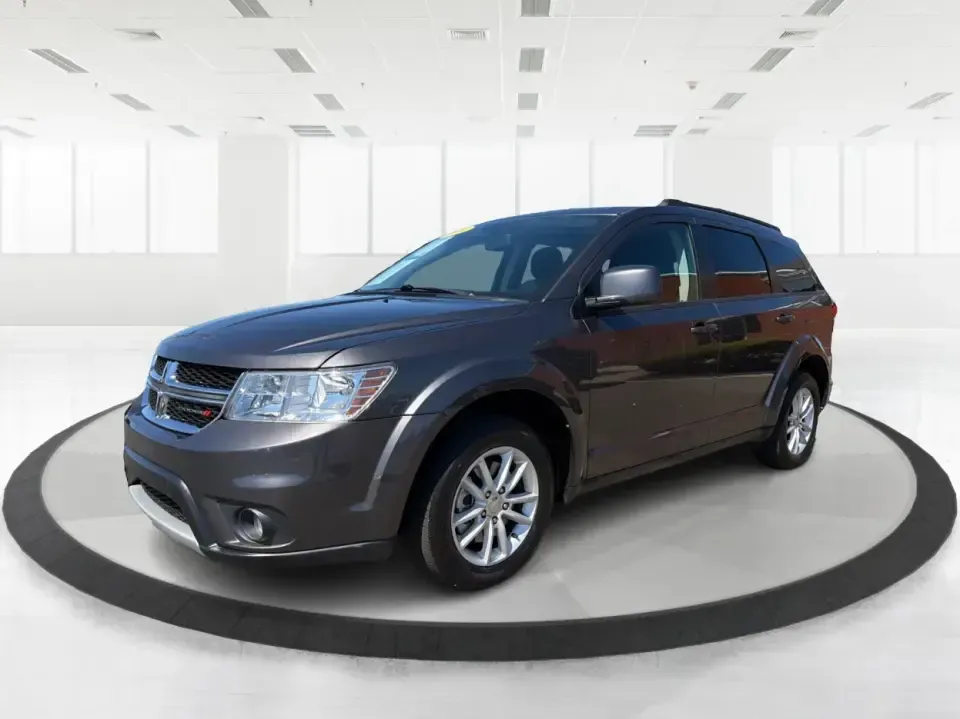 2014 Dodge Journey SXT (3C4PDDBG0ET) with an 3.6L V-6 DOHC engine, 6-Speed Automatic transmission, located at 1099 N County Rd 25A, Troy, OH, 45373, (937) 908-9800, 40.057079, -84.212883 - Pack up the kids, the dog, and the weekend bags-this 2014 Dodge Journey SXT is the kind of SUV that makes everyday life in Troy easier and spontaneous road trips feel completely doable. Whether you're tackling school drop-offs, commuting to Dayton, or planning a family day at the Miami County Fairgr - Photo#8