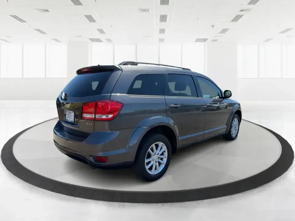 2014 Dodge Journey SXT (3C4PDDBG0ET) with an 3.6L V-6 DOHC engine, 6-Speed Automatic transmission, located at 1184 Kauffman Ave, Fairborn, OH, 45324, (937) 908-9800, 39.807072, -84.030914 - Pack up the kids, the dog, and the weekend bags-this 2014 Dodge Journey SXT is the kind of SUV that makes everyday life in Troy easier and spontaneous road trips feel completely doable. Whether you're tackling school drop-offs, commuting to Dayton, or planning a family day at the Miami County Fairgr - Photo#2