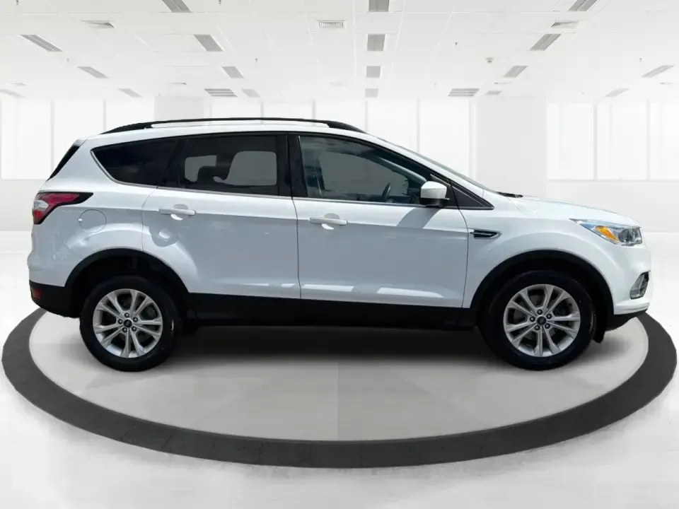 2018 Ford Escape SE (1FMCU0GD2JU) with an 1.5L L4 DOHC 16V engine, 6A transmission, located at 1951 S Dayton Lakeview Rd., New Carlisle, OH, 45344, (937) 908-9800, 39.890999, -84.050255 - Picture your next easy-to-live-with SUV: something that handles weekday commutes down I70, last-minute grocery runs near Brandt Pike, and weekend getaways to Buck Creek State Park without draining your budget. This 2018 Ford Escape SE is built for real life in Clark County-comfortable, efficient, an - Photo#1