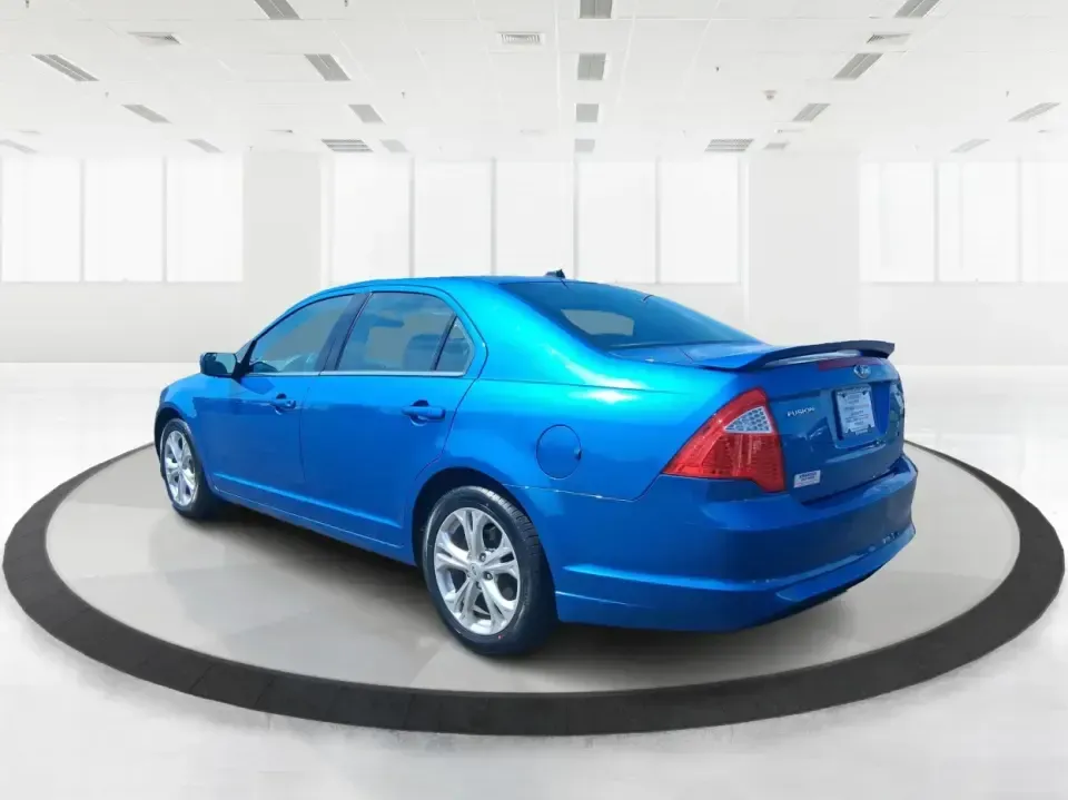 2012 Ford Fusion SE (3FAHP0HAXCR) with an 2.5L L4 DOHC 16V engine, located at 1099 N County Rd 25A, Troy, OH, 45373, (937) 908-9800, 40.057079, -84.212883 - Need a dependable sedan that makes everyday life easier-whether you're commuting down I-75 to Dayton, running errands around Troy, or planning a weekend drive past the Miami River and downtown's shops and festivals? This 2012 Ford Fusion SE in Blue Flame Metallic is a smart, comfortable choice for b - Photo#4