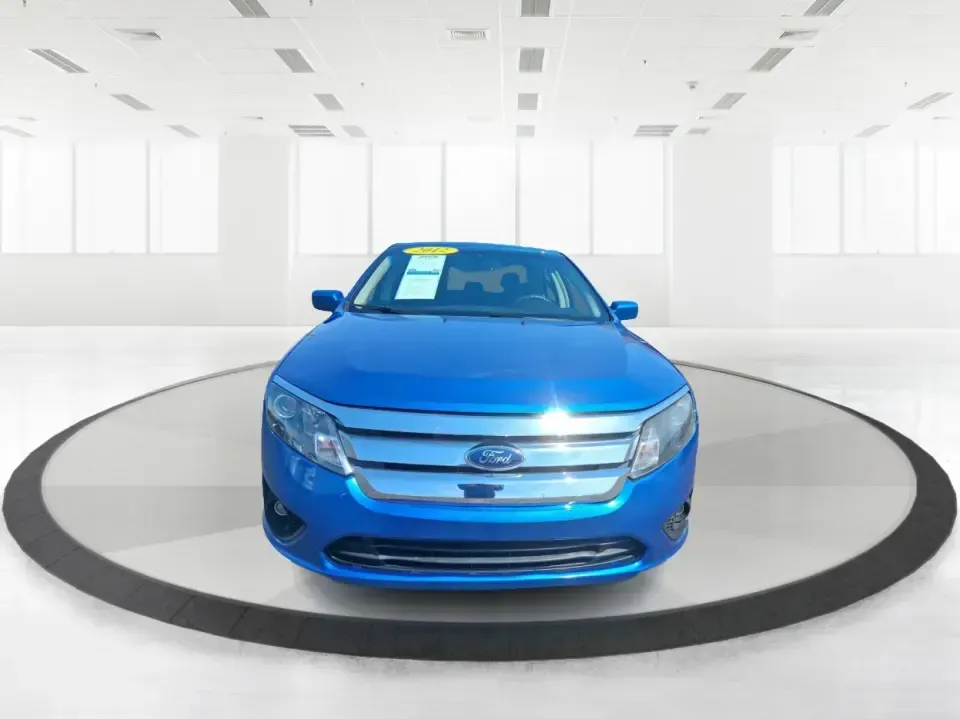 2012 Ford Fusion SE (3FAHP0HAXCR) with an 2.5L L4 DOHC 16V engine, located at 1099 N County Rd 25A, Troy, OH, 45373, (937) 908-9800, 40.057079, -84.212883 - Need a dependable sedan that makes everyday life easier-whether you're commuting down I-75 to Dayton, running errands around Troy, or planning a weekend drive past the Miami River and downtown's shops and festivals? This 2012 Ford Fusion SE in Blue Flame Metallic is a smart, comfortable choice for b - Photo#7