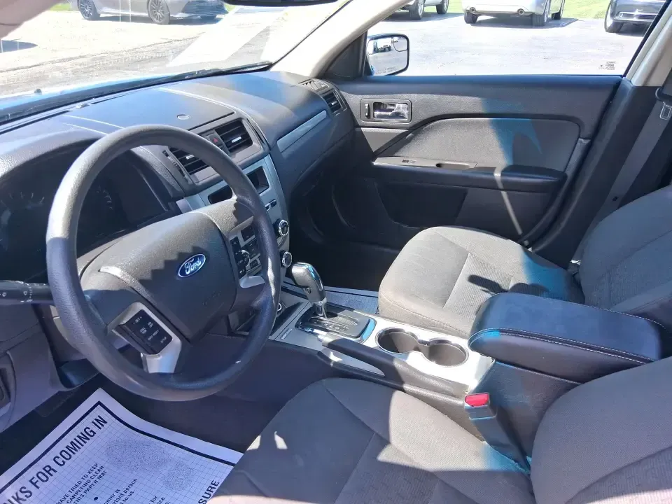 2012 Ford Fusion SE (3FAHP0HAXCR) with an 2.5L L4 DOHC 16V engine, located at 1099 N County Rd 25A, Troy, OH, 45373, (937) 908-9800, 40.057079, -84.212883 - Need a dependable sedan that makes everyday life easier-whether you're commuting down I-75 to Dayton, running errands around Troy, or planning a weekend drive past the Miami River and downtown's shops and festivals? This 2012 Ford Fusion SE in Blue Flame Metallic is a smart, comfortable choice for b - Photo#9