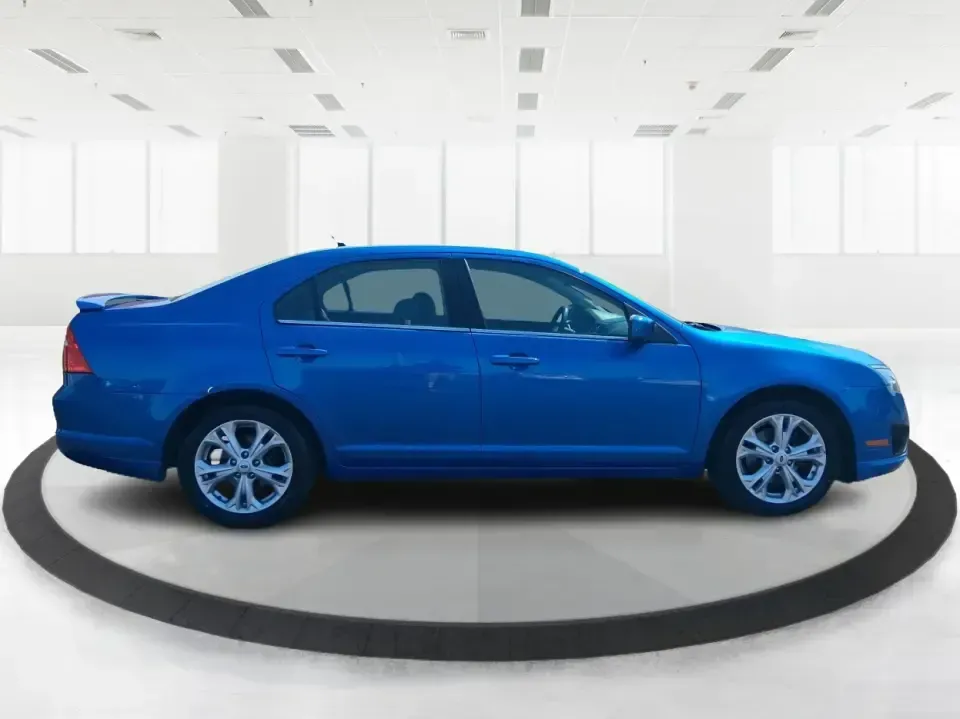 2012 Ford Fusion SE (3FAHP0HAXCR) with an 2.5L L4 DOHC 16V engine, located at 1230 East Main St, Xenia, OH, 45385, (937) 908-9800, 39.688026, -83.910172 - Need a dependable sedan that makes everyday life easier-whether you're commuting down I-75 to Dayton, running errands around Troy, or planning a weekend drive past the Miami River and downtown's shops and festivals? This 2012 Ford Fusion SE in Blue Flame Metallic is a smart, comfortable choice for b - Photo#1