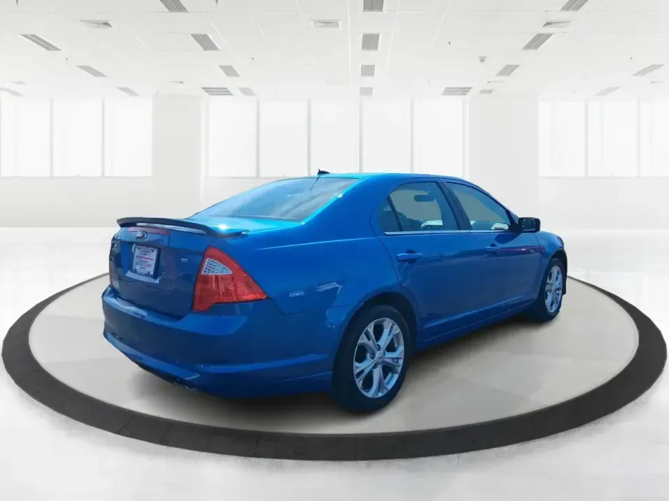 2012 Ford Fusion SE (3FAHP0HAXCR) with an 2.5L L4 DOHC 16V engine, located at 1230 East Main St, Xenia, OH, 45385, (937) 908-9800, 39.688026, -83.910172 - Need a dependable sedan that makes everyday life easier-whether you're commuting down I-75 to Dayton, running errands around Troy, or planning a weekend drive past the Miami River and downtown's shops and festivals? This 2012 Ford Fusion SE in Blue Flame Metallic is a smart, comfortable choice for b - Photo#2