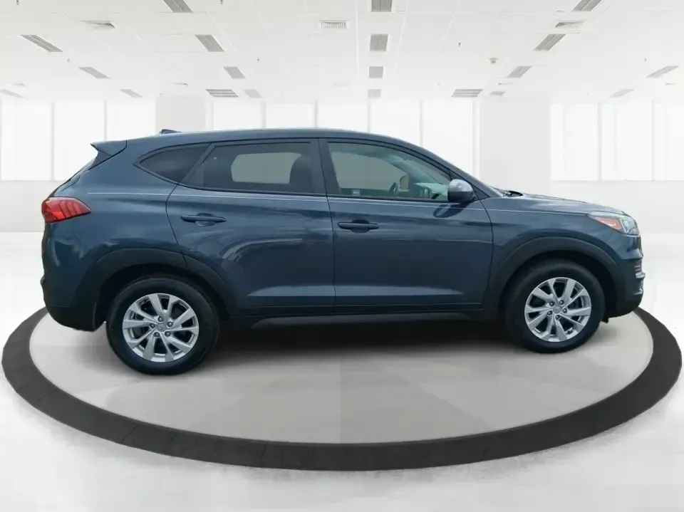 2019 Hyundai Tucson SE (KM8J23A41KU) with an Nu 2L I-4 gasoline direct injection engine, 6A transmission, located at 8750 N County Rd 25A, Piqua, OH, 45356, (937) 908-9800, 40.164391, -84.232513 - Need a practical SUV that can handle the daily school run, a long commute up I75, and weekend trips to the Miami Valley without draining your budget? This 2019 Hyundai Tucson SE in eye-catching Dusk Blue is built for real life in Piqua, Ohio-easy to park, comfortable for passengers, and ready for ev - Photo#1