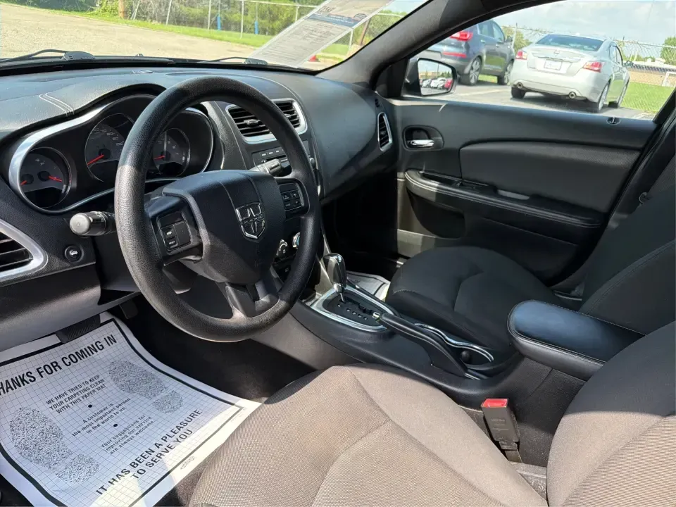 2014 Dodge Avenger SE (1C3CDZAG6EN) with an 3.6L V6 DOHC 24V FFV engine, 6-Speed Automatic transmission, located at 401 Woodman Dr, Riverside, OH, 45431, (937) 908-9800, 39.760899, -84.123421 - Need a comfortable, budget-friendly sedan that can handle the daily grind from Riverside to Downtown Dayton, quick school drop-offs, and the occasional weekend escape to Carillon Historical Park or a lap around the National Museum of the U.S. Air Force? This 2014 Dodge Avenger SE in eye-catching Tru- Photo#9