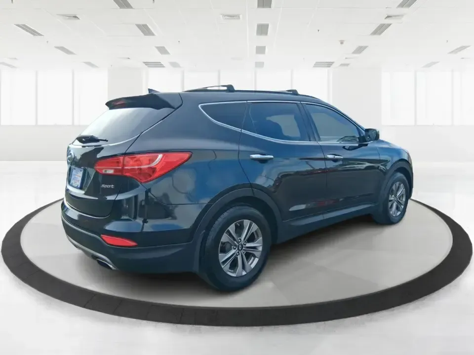 2015 Hyundai Santa Fe 2.4L (5XYZU3LB1FG) with an Theta II 2.4L I-4 gasoline direct injection engine, 6-Speed Automatic transmission, located at 1099 N County Rd 25A, Troy, OH, 45373, (937) 908-9800, 40.057079, -84.212883 - Pack up the kids for a weekend at Treasure Island Park, load the cooler for a day on the Great Miami River, or settle into a comfortable daily commute down I75-this 2015 Hyundai Santa Fe 2.4L is the kind of practical SUV that fits real life in Troy. With confident road manners, flexible cargo space, - Photo#2