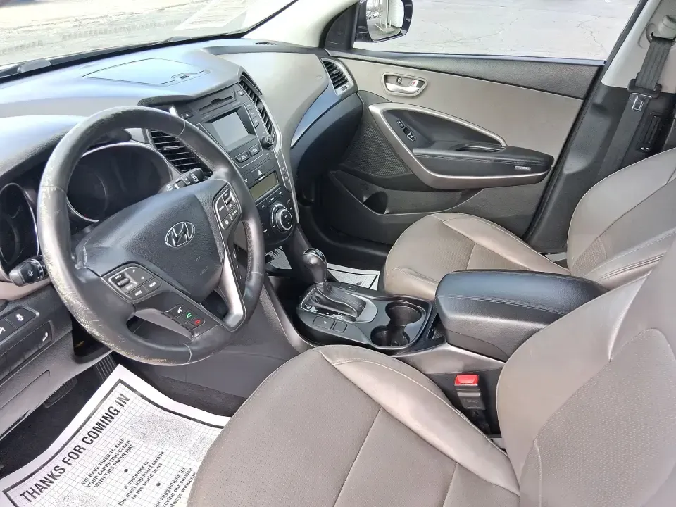 2015 Hyundai Santa Fe 2.4L (5XYZU3LB1FG) with an Theta II 2.4L I-4 gasoline direct injection engine, 6-Speed Automatic transmission, located at 1099 N County Rd 25A, Troy, OH, 45373, (937) 908-9800, 40.057079, -84.212883 - Pack up the kids for a weekend at Treasure Island Park, load the cooler for a day on the Great Miami River, or settle into a comfortable daily commute down I75-this 2015 Hyundai Santa Fe 2.4L is the kind of practical SUV that fits real life in Troy. With confident road manners, flexible cargo space, - Photo#9