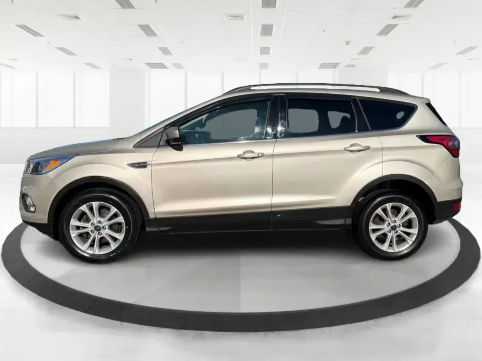 2018 Ford Escape SE FWD (1FMCU0GD6JU) with an 1.5L L4 DOHC 16V engine, 6A transmission, located at 1099 N County Rd 25A, Troy, OH, 45373, (937) 908-9800, 40.057079, -84.212883 - Weekday commute down I75, school drop-offs, and spontaneous weekend getaways to Charleston Falls Preserve all get easier in a compact SUV that fits real life. This 2018 Ford Escape SE FWD is a smart pick for Troy, Ohio drivers who want SUV versatility without the bulk-easy to park near downtown Troy- Photo#5