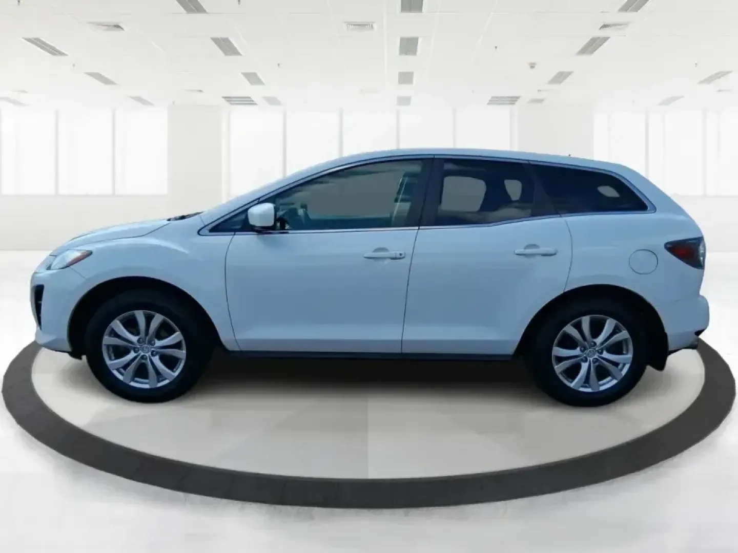2010 Mazda CX-7 s Touring (JM3ER4W33A0) with an 2.3L I-4 gasoline direct injection engine, 6-Speed Automatic transmission, located at 8750 N County Rd 25A, Piqua, OH, 45356, (937) 908-9800, 40.164391, -84.232513 - Picture your next weekend: loading up the cargo area for a day at Miami County Park, cruising up I75 for a quick getaway, or confidently handling Ohio's surprise rain and winter slush on the school run. This 2010 Mazda CX7 s Touring is the kind of sporty, practical SUV that fits real life in Troy-ea - Photo#5
