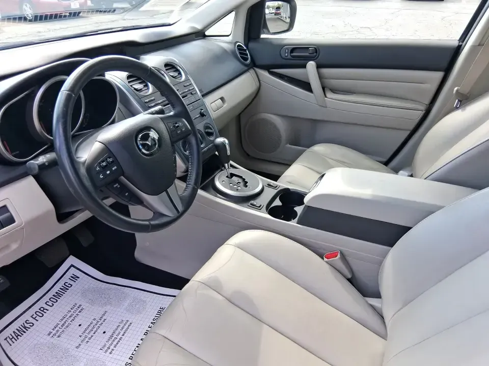 2010 Mazda CX-7 s Touring (JM3ER4W33A0) with an 2.3L I-4 gasoline direct injection engine, 6-Speed Automatic transmission, located at 1099 N County Rd 25A, Troy, OH, 45373, (937) 908-9800, 40.057079, -84.212883 - Picture your next weekend: loading up the cargo area for a day at Miami County Park, cruising up I75 for a quick getaway, or confidently handling Ohio's surprise rain and winter slush on the school run. This 2010 Mazda CX7 s Touring is the kind of sporty, practical SUV that fits real life in Troy-ea - Photo#9