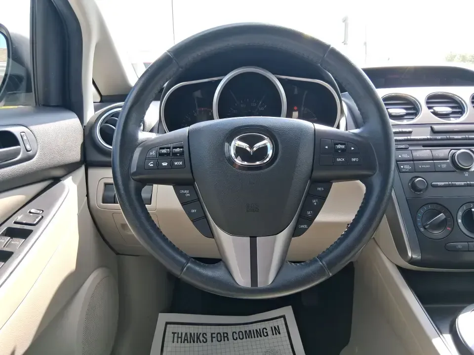 2010 Mazda CX-7 s Touring (JM3ER4W33A0) with an 2.3L I-4 gasoline direct injection engine, 6-Speed Automatic transmission, located at 1099 N County Rd 25A, Troy, OH, 45373, (937) 908-9800, 40.057079, -84.212883 - Picture your next weekend: loading up the cargo area for a day at Miami County Park, cruising up I75 for a quick getaway, or confidently handling Ohio's surprise rain and winter slush on the school run. This 2010 Mazda CX7 s Touring is the kind of sporty, practical SUV that fits real life in Troy-ea - Photo#16