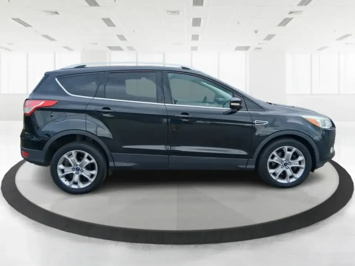 2014 Ford Escape Titanium (1FMCU9J99EU) with an 2.0L L4 DOHC 16V engine, 6-Speed Automatic transmission, located at 1099 N County Rd 25A, Troy, OH, 45373, (937) 908-9800, 40.057079, -84.212883 - Need one SUV that can handle an Ohio winter commute, school drop-offs, and a spontaneous weekend road trip to Hocking Hills without feeling like a compromise? This 2014 Ford Escape Titanium 4WD in sleek Tuxedo Black is built for real life in Troy-comfortable for long drives, confident in bad weather - Photo#1