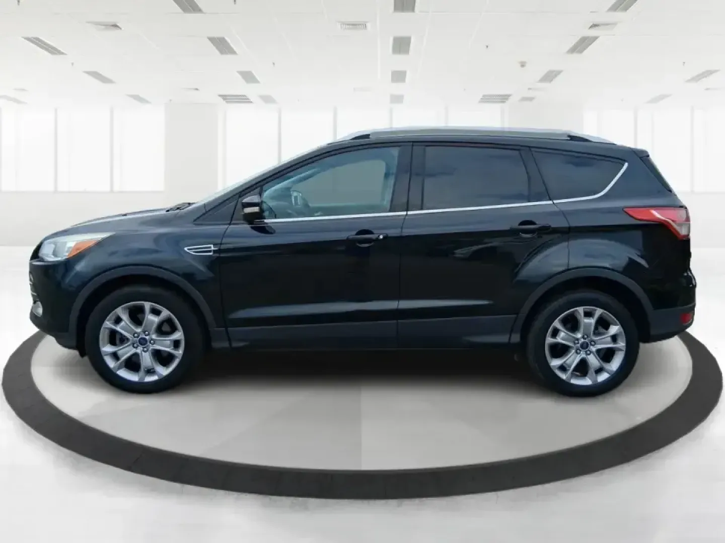 2014 Ford Escape Titanium (1FMCU9J99EU) with an 2.0L L4 DOHC 16V engine, 6-Speed Automatic transmission, located at 1099 N County Rd 25A, Troy, OH, 45373, (937) 908-9800, 40.057079, -84.212883 - Need one SUV that can handle an Ohio winter commute, school drop-offs, and a spontaneous weekend road trip to Hocking Hills without feeling like a compromise? This 2014 Ford Escape Titanium 4WD in sleek Tuxedo Black is built for real life in Troy-comfortable for long drives, confident in bad weather - Photo#5